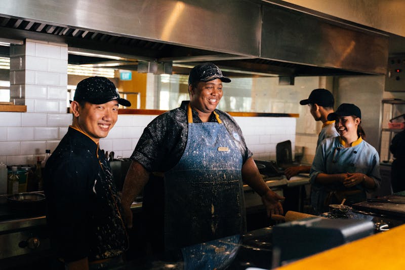 The Cafe Rio team working together in the kitchen with fresh produce